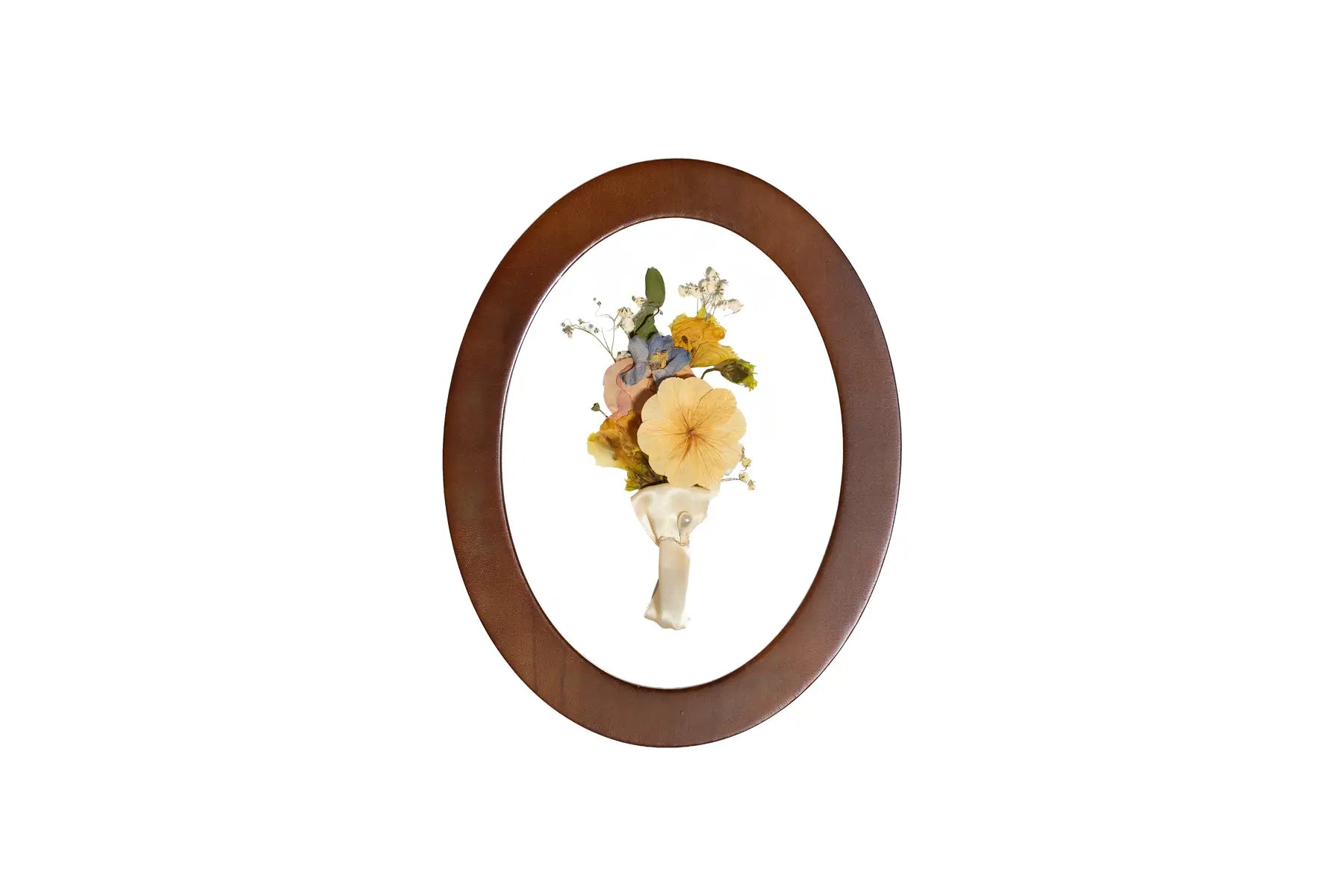 Toasted Oak oval pressed flower frame displays preserved wedding boutonniere.