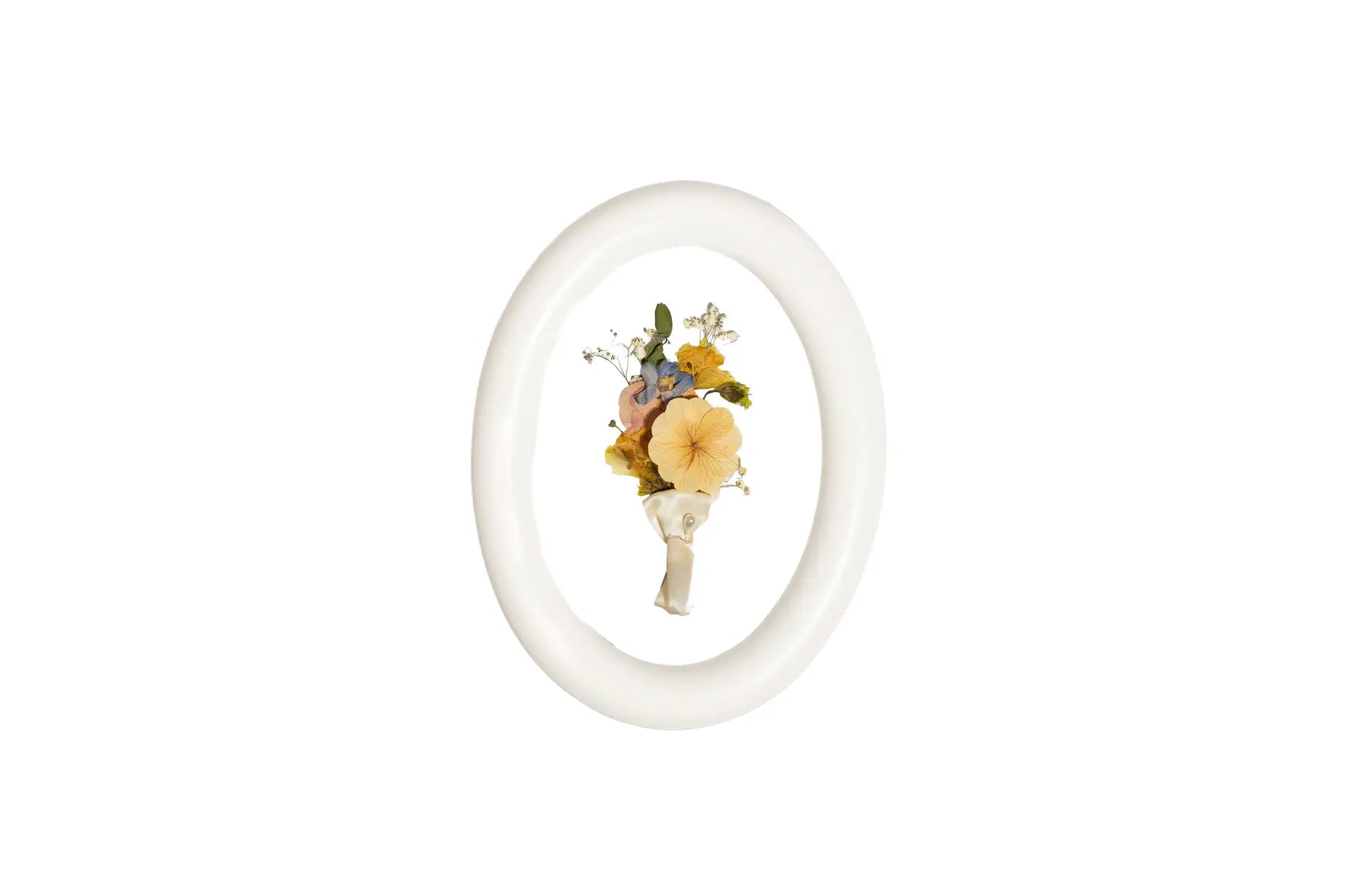 Linen White rounded wood frame displays orange and white groom boutonniere.