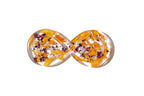 Infinity shape figure 8 dish with orange and purple wedding flowers preserved in resin.