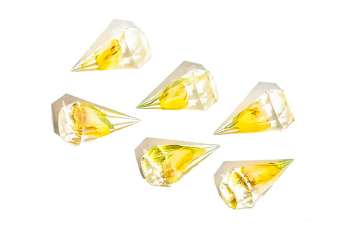 Six resin flower ring holders with yellow single flowers.