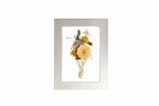 Bright Silver handmade frame displays groom boutonniere colorful flowers.
