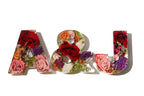 Small decorative resin letters 'A', '&', and 'J' made of pink and red bridal flowers