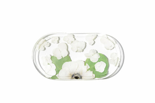 A 7.5 inch oval catch all dish preserving white anemone wedding flowers in resin.