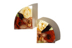 Red roses and carnations preserved in large resin bookends