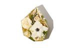 Gem shaped flower arrangement preservation in clear resin for wedding flowers.