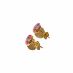 Gold stud earrings with colorful resin flowers preserved from a wedding