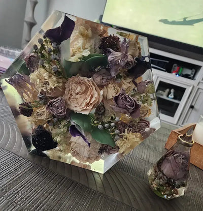 Preserved wedding flowers in a large hexagon resin block with matching ring holder
