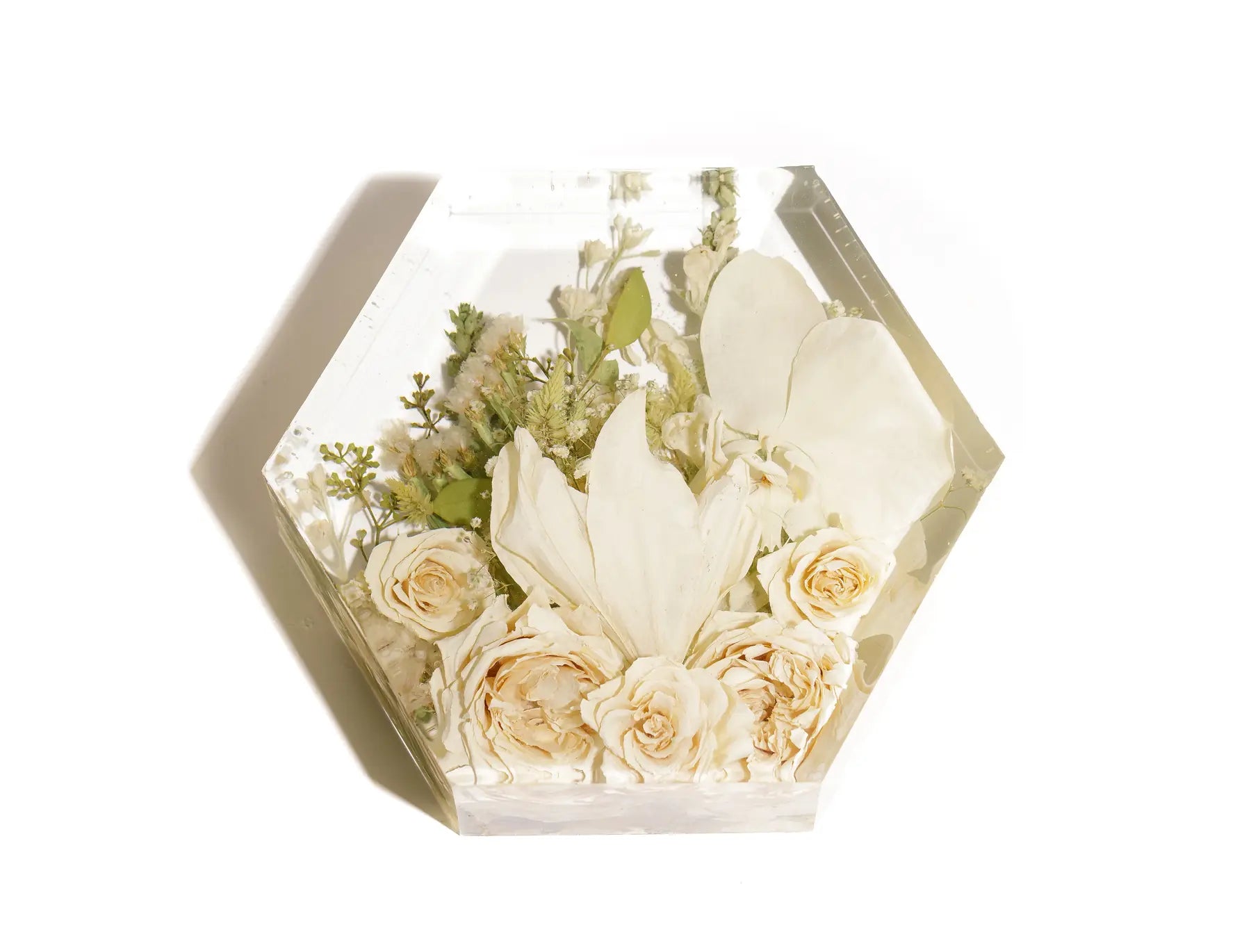 White arrangement of wedding flowers preserved in resin in a 8x9x3 inch size.
