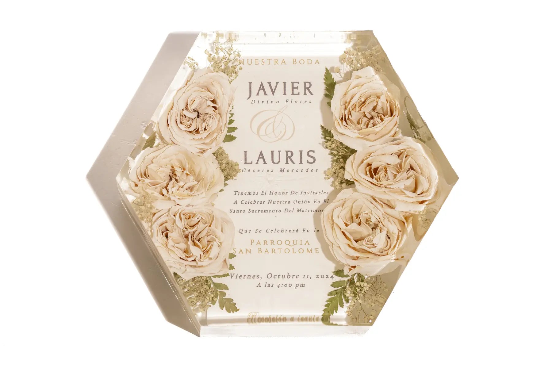A large 11 inch hexagon bouquet block made of resin, preserving a wedding invitation surrounded by pink roses.
