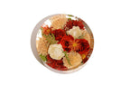 A 12 inch round bouquet block with resin preserved wedding roses and carnations.
