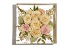 A wedding bouquet of roses forever preserved in a large resin square bouquet block.