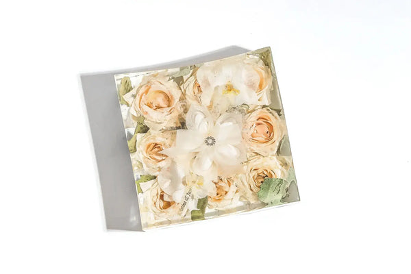 Medium square bouquet block with roses and custom ribbon featuring the names of the bridal couple