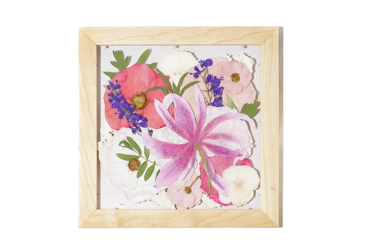 Framed artwork of pressed pink and purple flowers with no matboard and natural wood frame