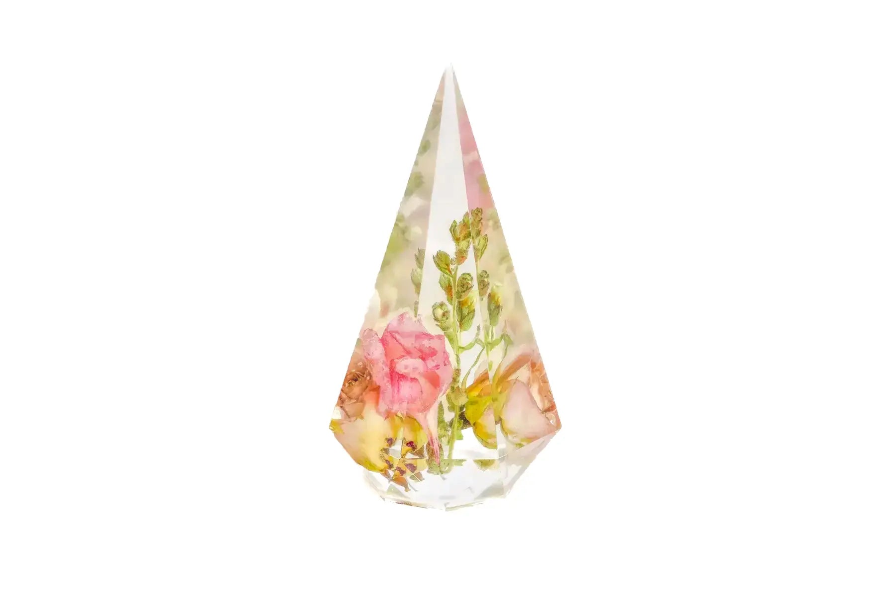 Preserved pink wedding flowers presented in a resin ring holder.