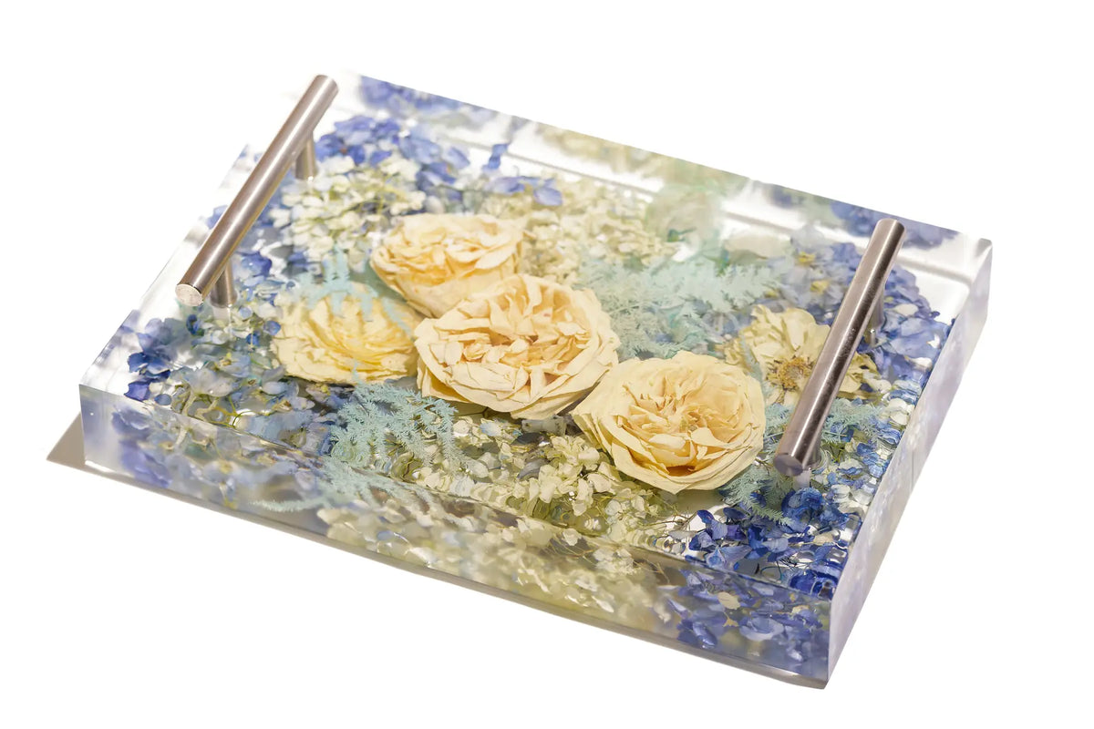 An 8x11 inch serving tray with a 3 inch depth and silver handles featuring a lavender filled bouquet.