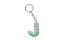 Keychain with letter 'J' with pink and purple flowers preserved in resin