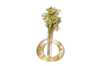 A round open circle flower vase made of wedding flowers preserved in resin.