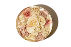 A bunch of pink and white wedding roses preserved in a 9 inch round resin block.