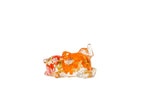 Side sleeping cat with pink flowers preserved in this resin figurine