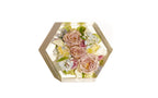A small hexagon 7x8x2 of preserved wedding flowers in clear resin.