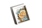 Framed arrangement of preserved wedding flowers in an 8x10 white shadow box