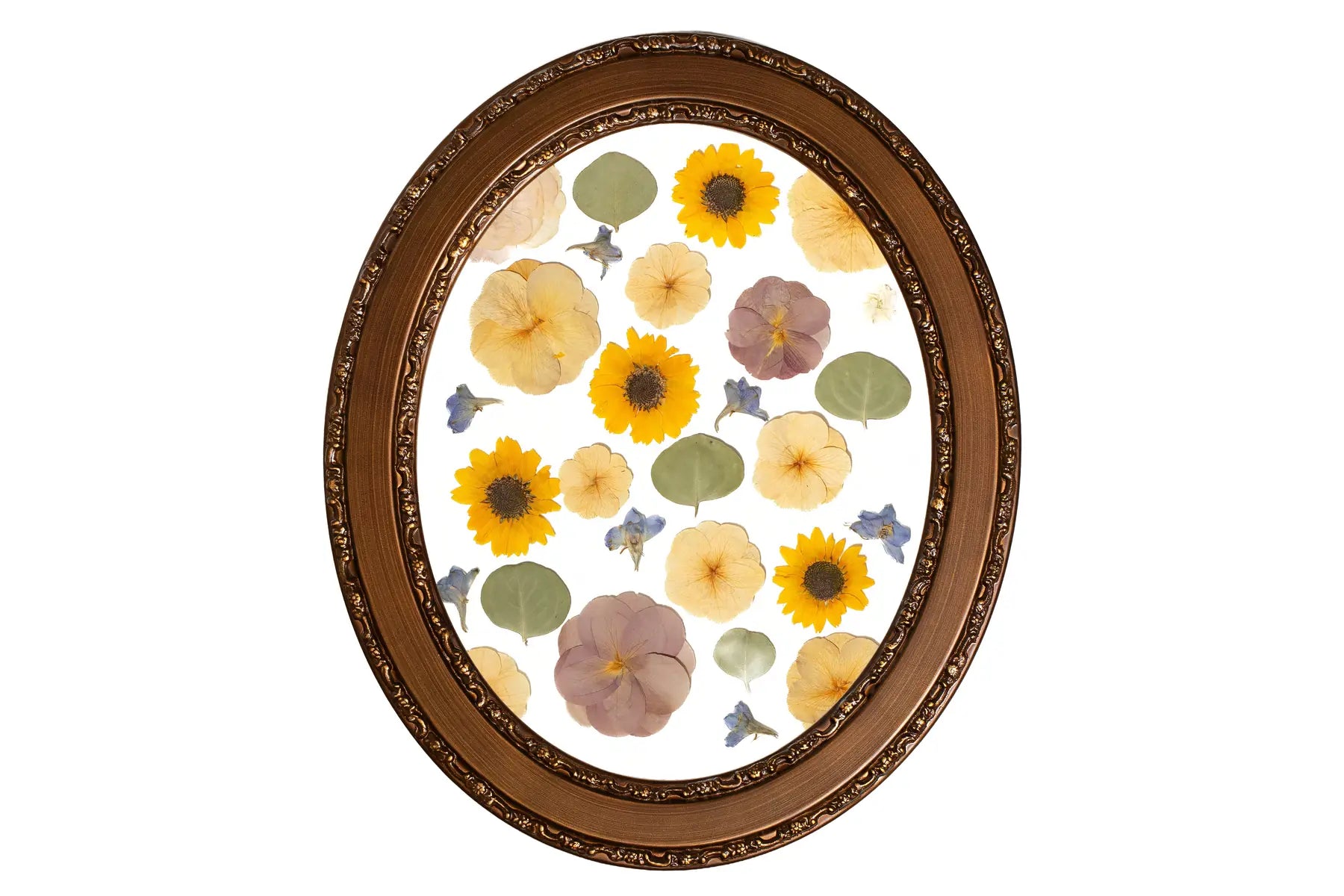 Pressed and preserved flowers in an oval handmade wooden frame in a spaced pattern