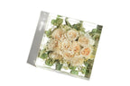 A large square resin bouquet block featuring a bouquet of preserved white bridal roses.