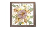 Framed wedding floral arrangement preserved and color corrected in a brown wooden frame