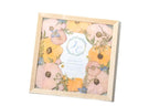 11x11 square pressed flower frame with wedding bouquet and a wedding invitation center oriented 