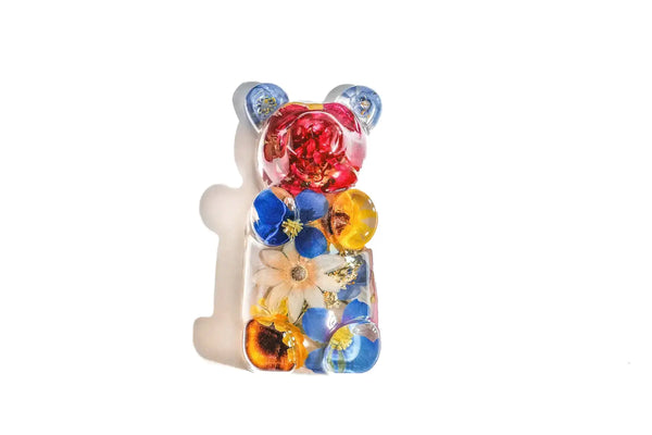 Colorful glass bear figurine with resin preserved wedding flowers