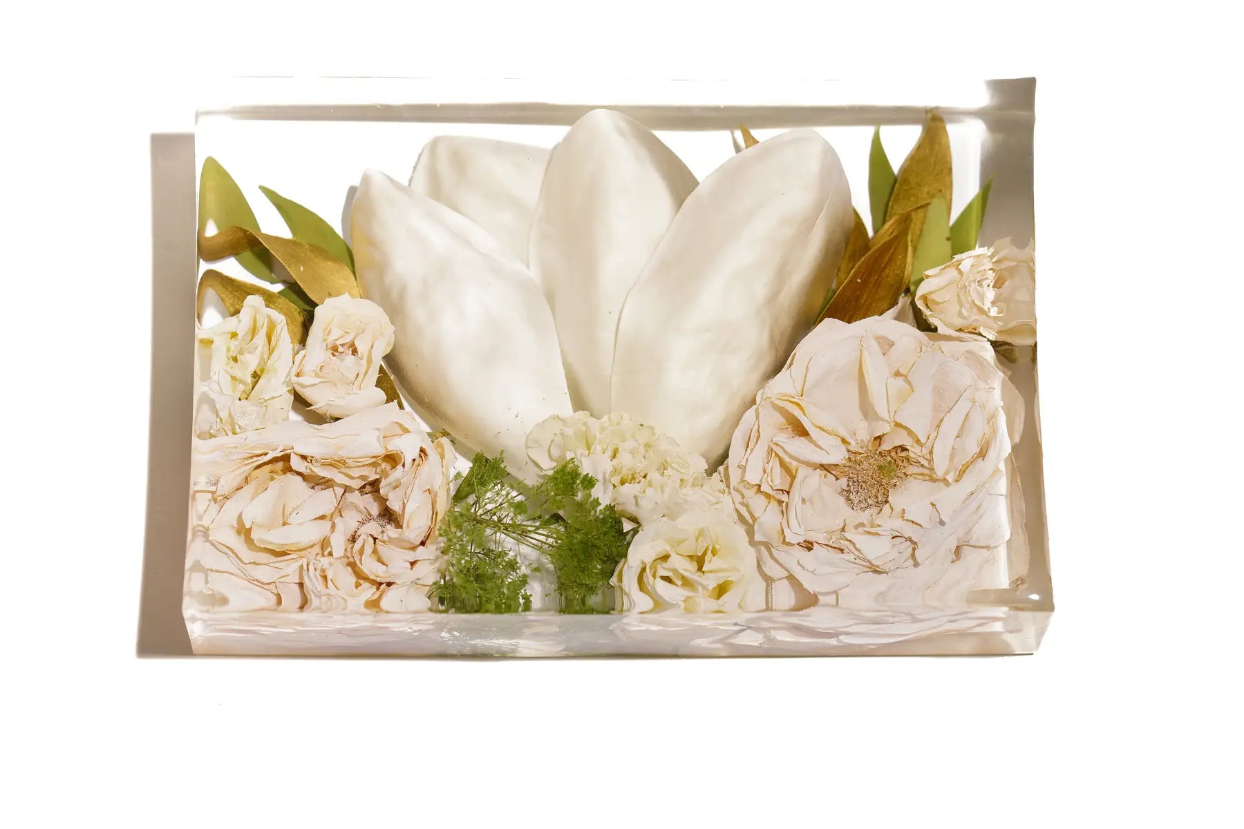 Pink roses and tulips preserved in a rectangular resin bouquet block.