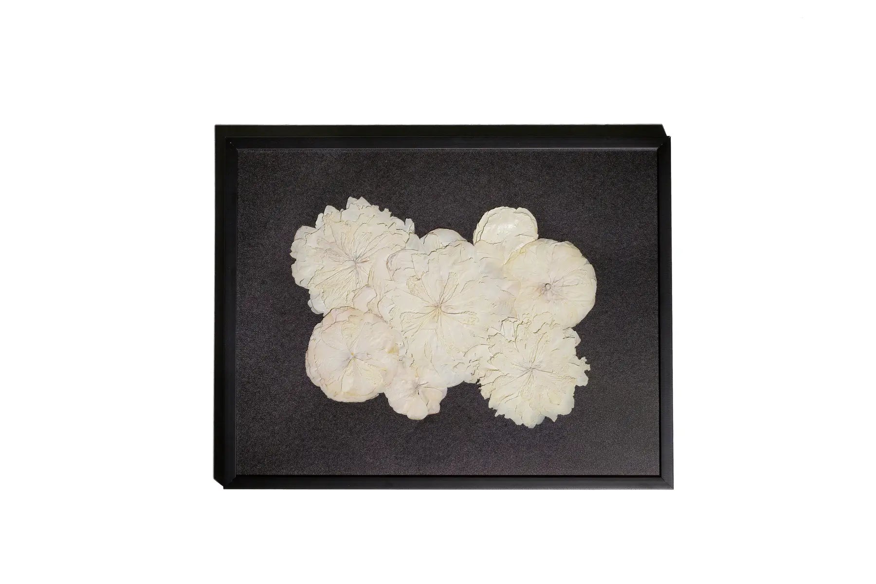 Black matboard and white wedding bouquet in black handmade wooden frame.
