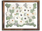 Preserved wedding bouquet of white flowers in a large handmade wooden brown stained frame