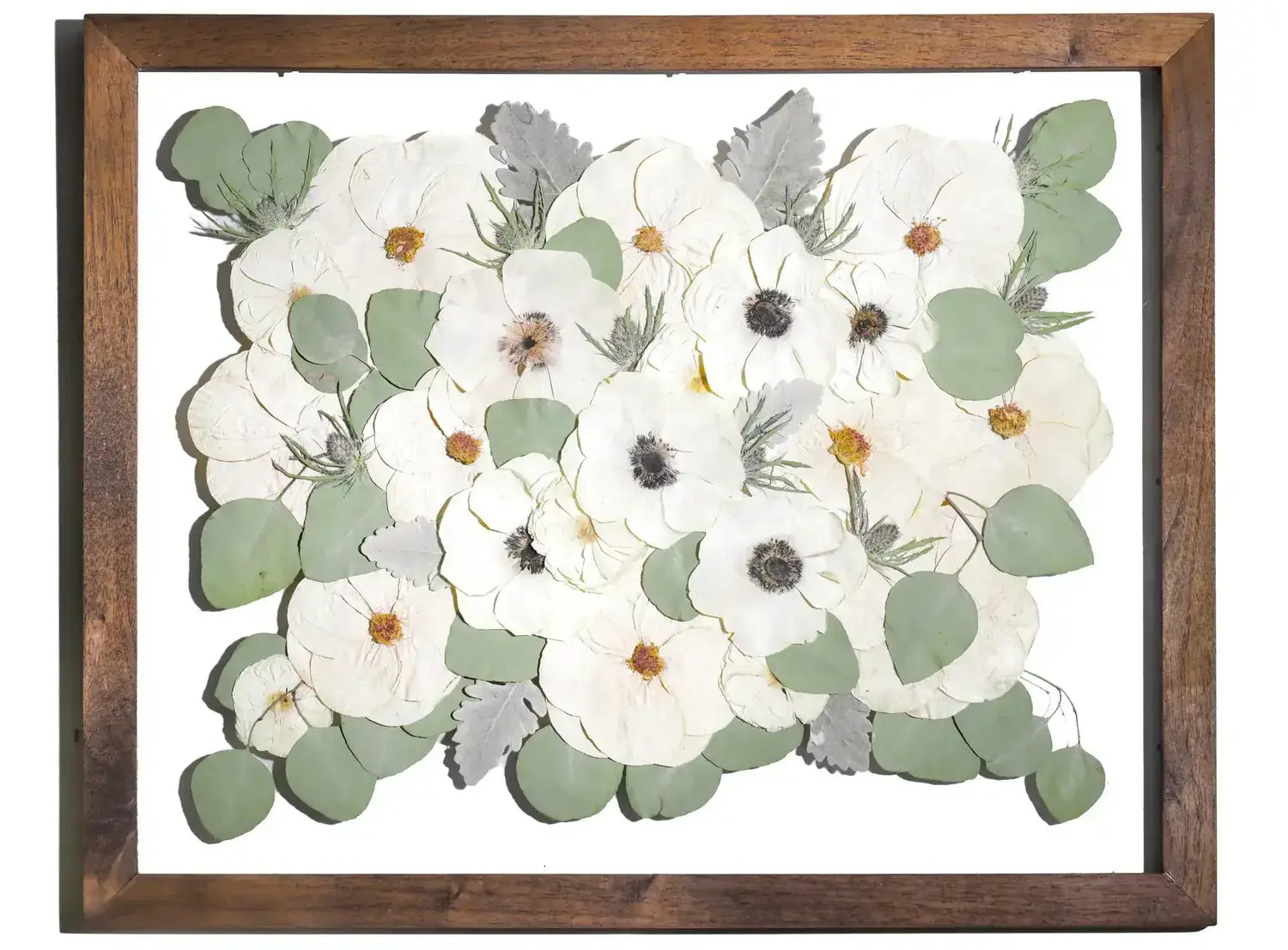 Preserved wedding bouquet of white flowers in a large handmade wooden brown stained frame