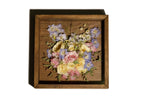 Wooden handmade shadow box with spring bouquet of wedding flowers